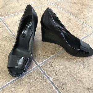 Leather and patent peep toe pump.